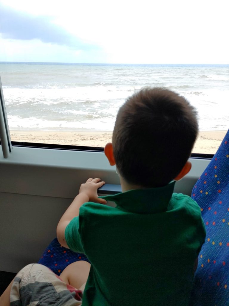 boy looking outside the gangneug sea train