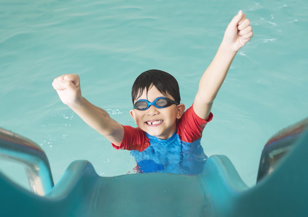 little boy enjoying the water park